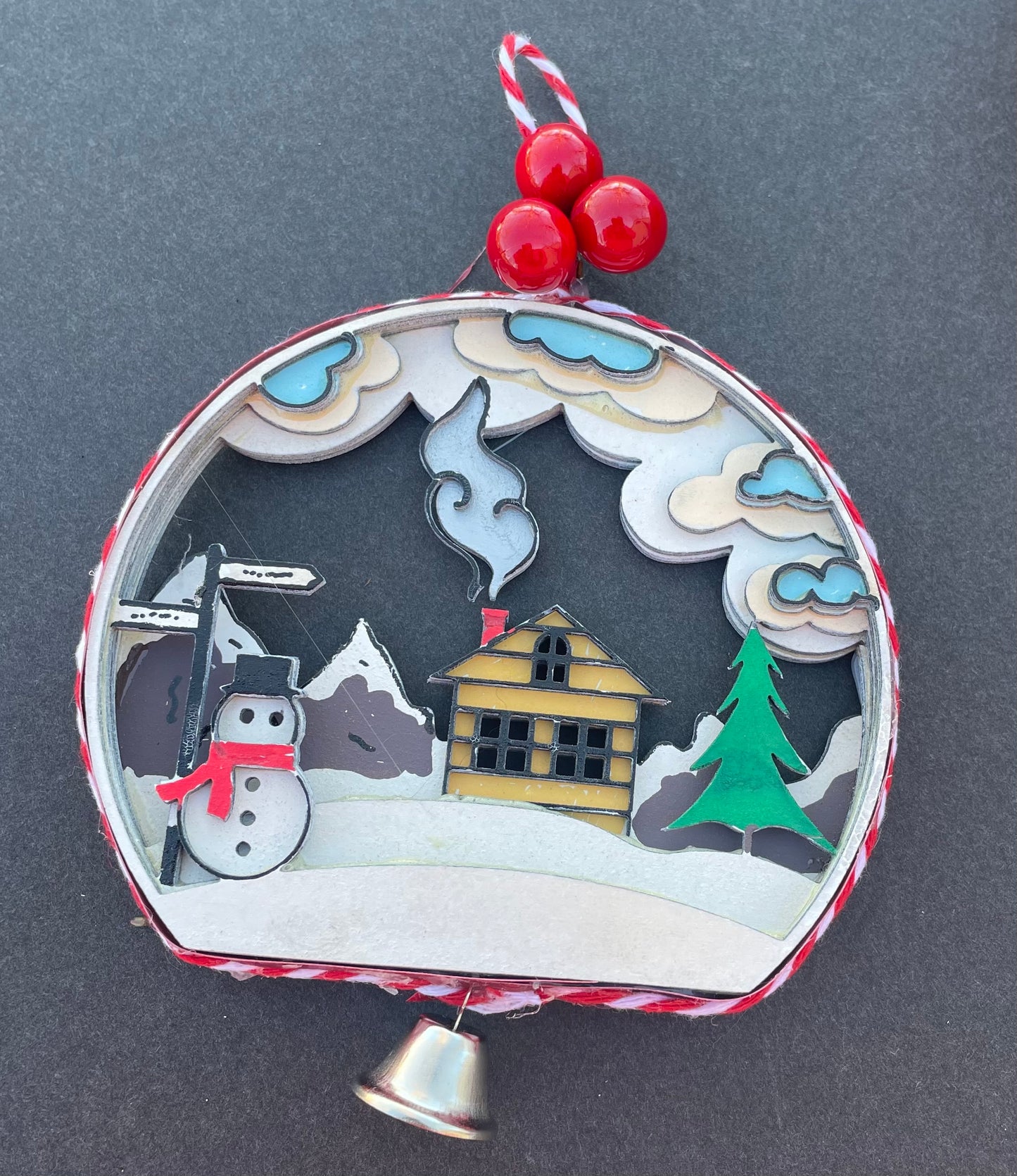 Snowman in the mountains ornament.